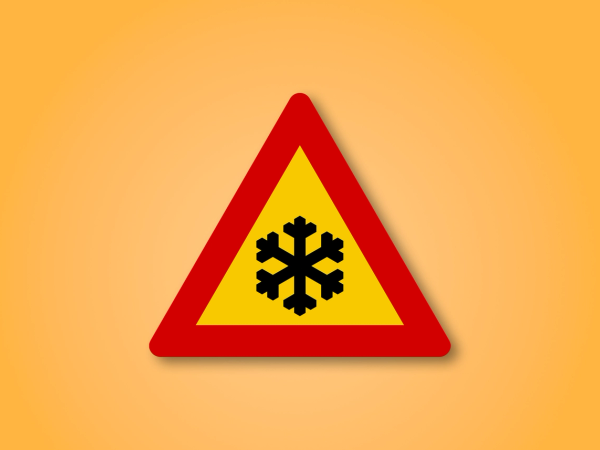a yellow and red triangle with a snowflake on it