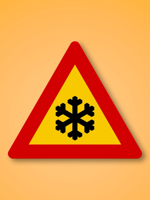 a yellow and red triangle with a snowflake on it