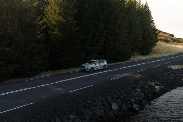 BMW X3 SUV BMW X3 SUV driving a road in Iceland