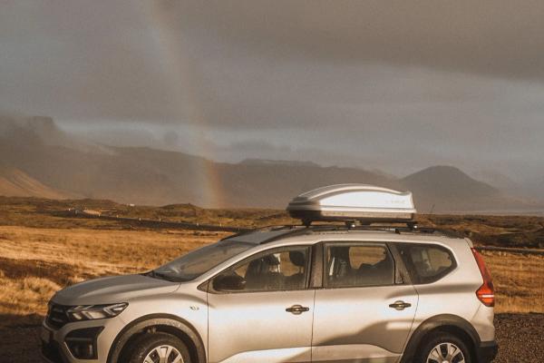 Dacia Jogger Dacia Jogger with a rood box parked with a rainbow in the background