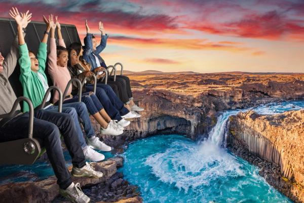 FlyOver Iceland People Flying over iceland with a waterfall below them