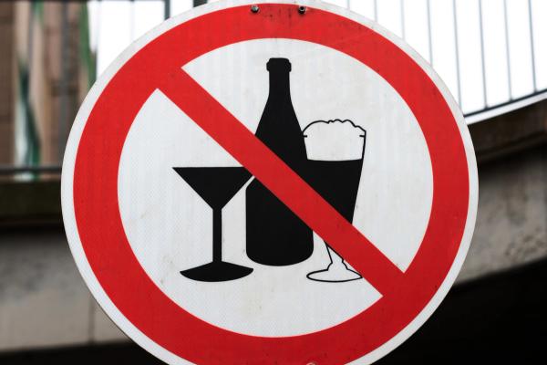 No alcohol sign with a bottle, martini glass, and beer glass crossed out.