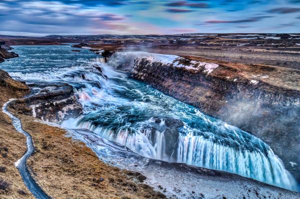 there is a waterfall in the middle of a river at Gullfoss in Iceland.