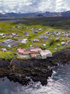 an aerial view of a small town on a small island in the middle of the ocean .