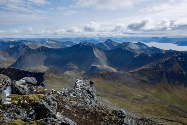 a view of a mountain range from the top of a mountain .