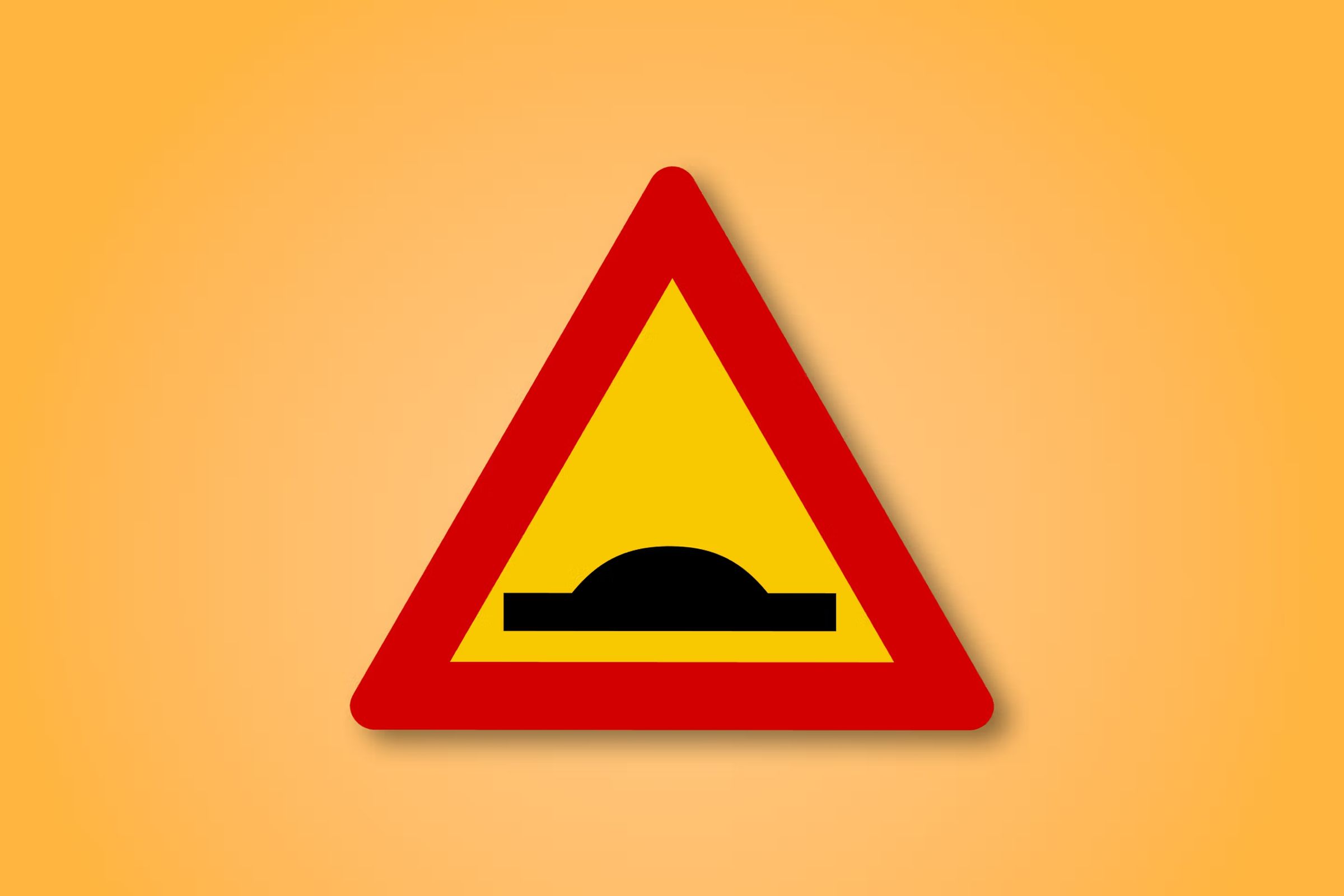 a yellow and red triangle sign with a black circle in the middle on an orange background .