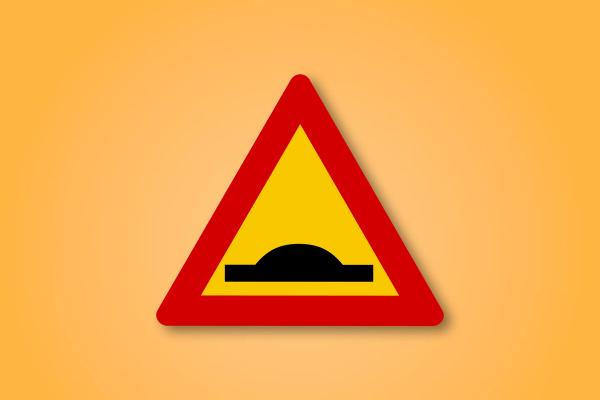 a yellow and red triangle sign with a black circle in the middle on an orange background .