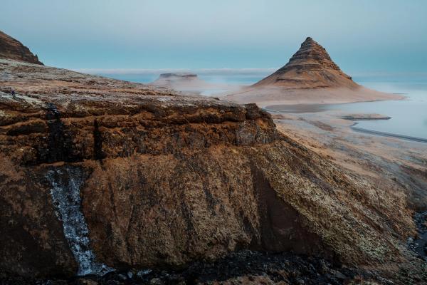 foggy landscape with cliff and mountain