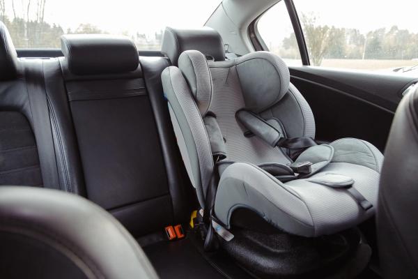 Ensuring Child Safety while Exploring Iceland: The Importance of a Booster Seat in Rental Cars. Booster seat placed in the backseat of a rental car in Iceland.