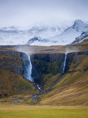 Panoramic view of Grundarfoss with snowed mountains in the background