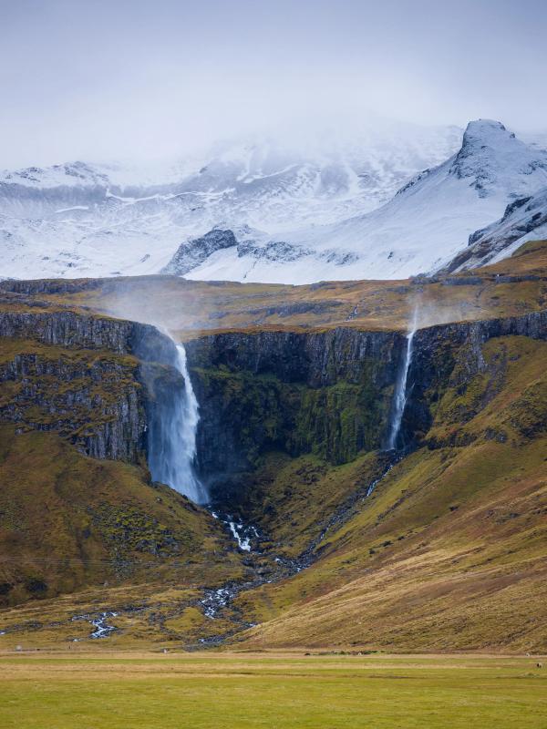 Panoramic view of Grundarfoss with snowed mountains in the background