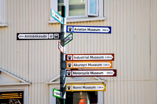 a street post with cultural spots directions