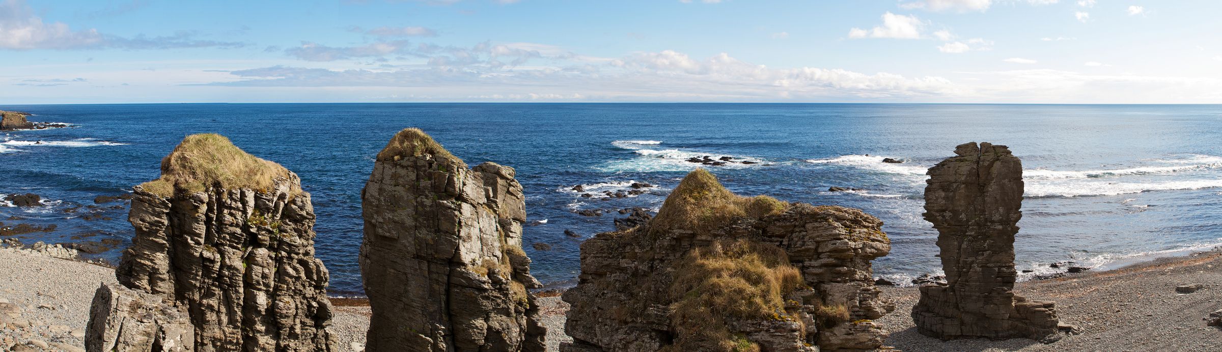 Rock pilars near the sea on a sunny day