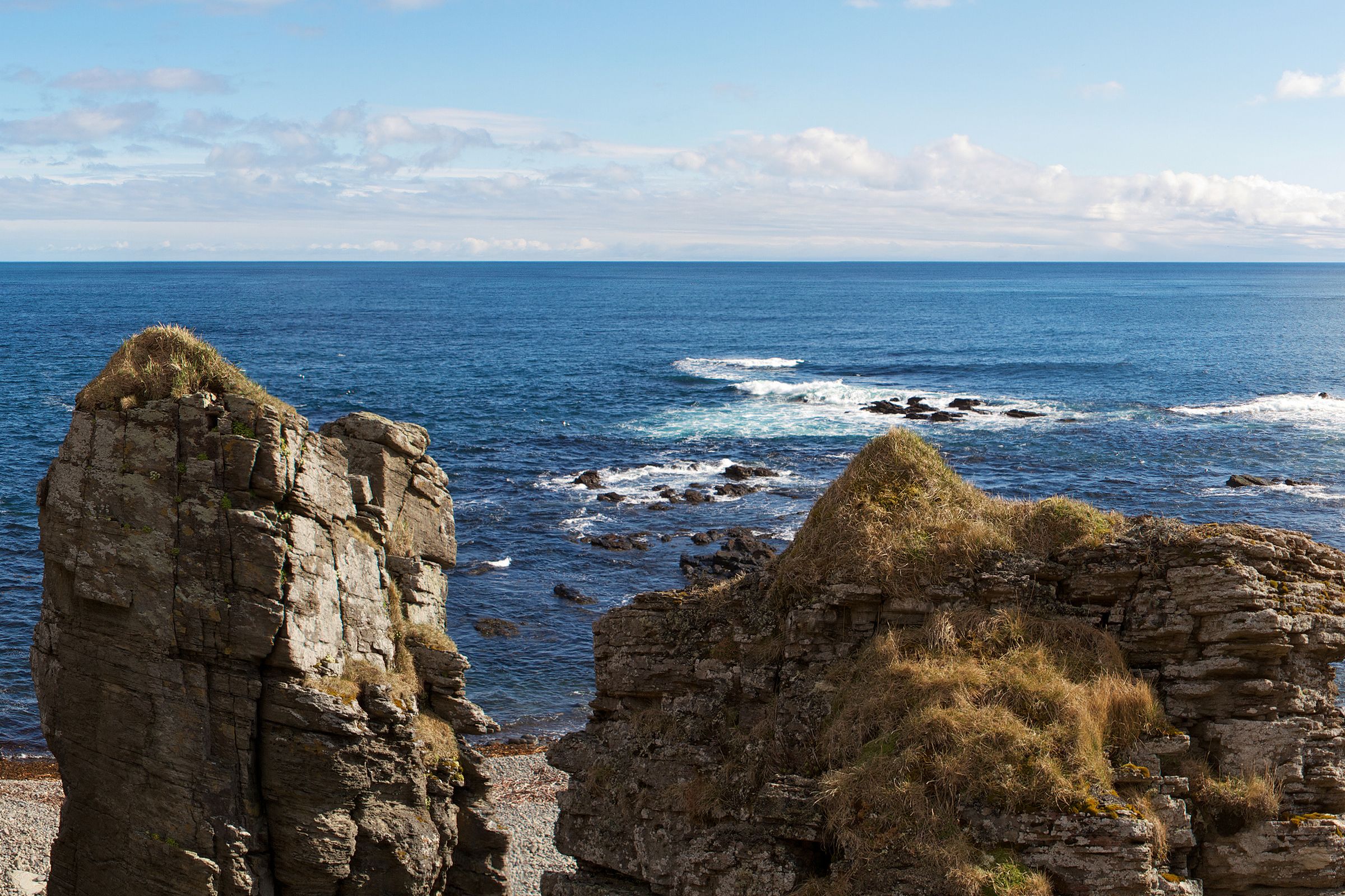 Rock pilars near the sea on a sunny day