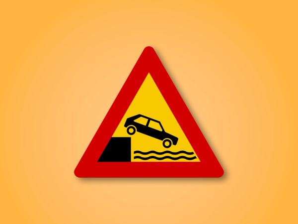 a yellow and red sign with a car on it