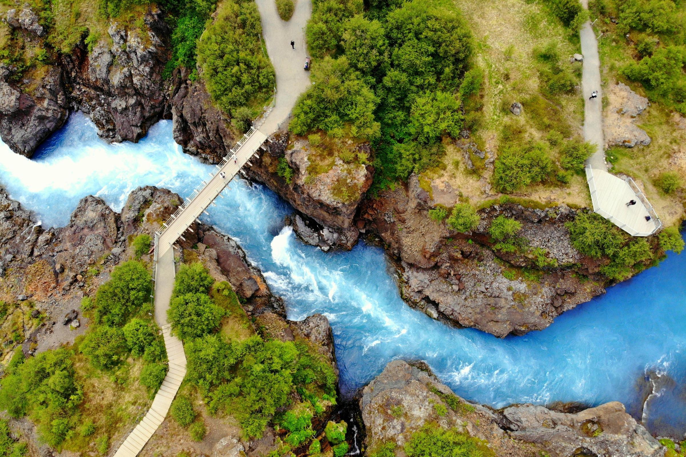 Turquoise river with a bridge and a viewpoint seen from above