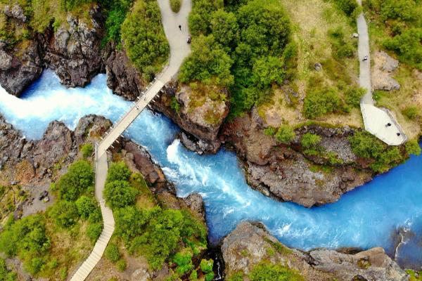 Turquoise river with a bridge and a viewpoint seen from above