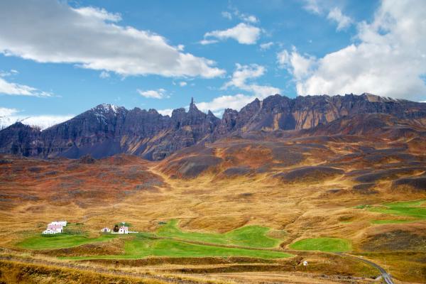 Brown valley with a couple of small houses