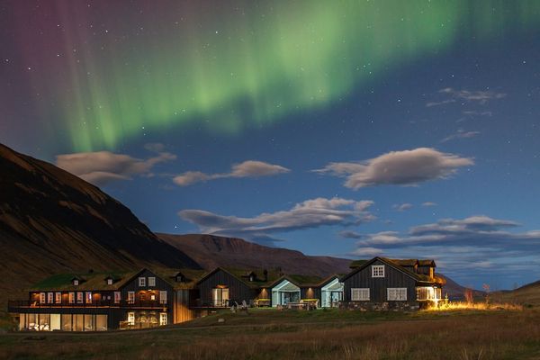 incredible northern lights at eleven deplar farm, Iceland Amazing view on the lodges at eleven deplar farm