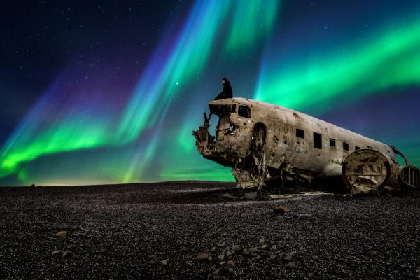 Northern lights over plane wreckage in Iceland