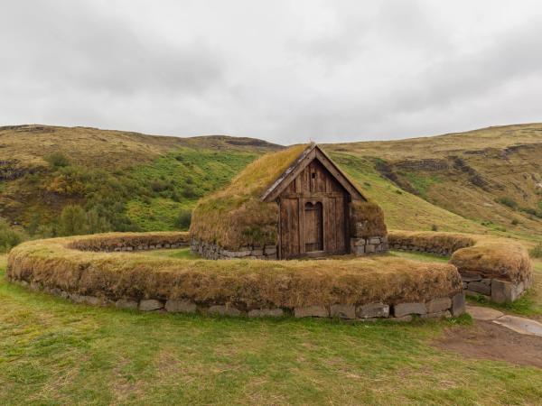 a turf house covered by moss