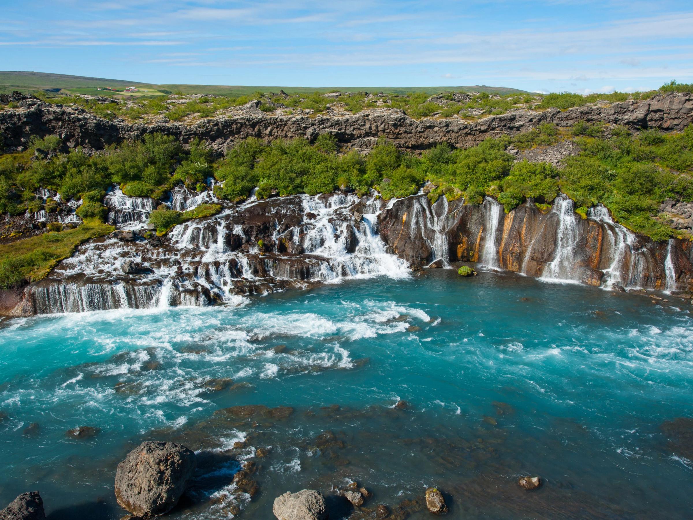 Hraunfossar Waterfall on sunny day