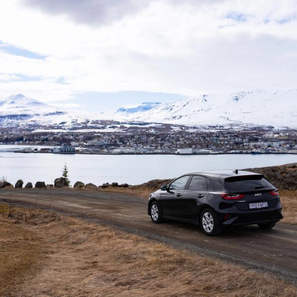 Black car in front of a lake in Iceland