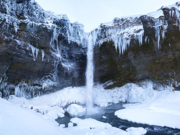 Kvernufoss Waterfall with snow and ice