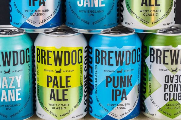 a group of cans of beer are sitting next to each other on a table in a brewerie in Iceland.