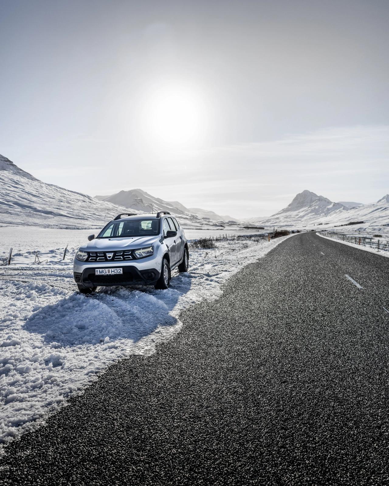 A dacia Duster parked on a road in winter in Iceland 