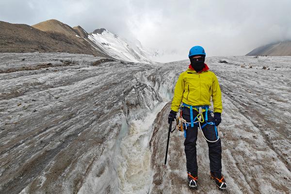 Man wearing all the necessary equipment for glacier hiking