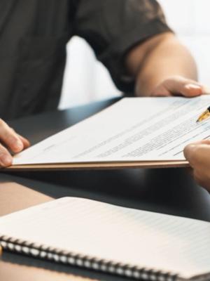 A group of tourists reading an Iceland car rental agreement Tourists reading Iceland car rental agreement before their trip