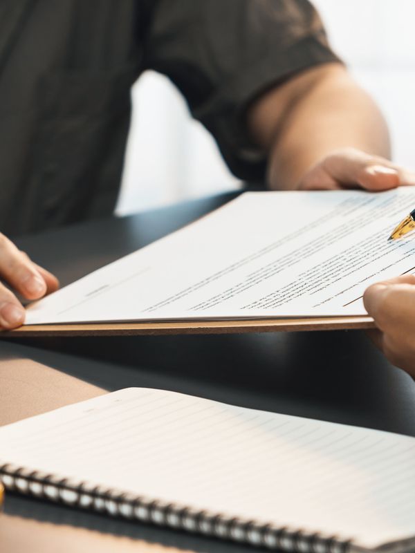 A group of tourists reading an Iceland car rental agreement Tourists reading Iceland car rental agreement before their trip