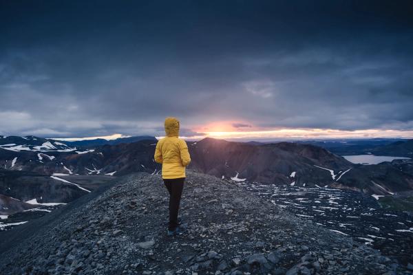 Hiker in the Blahnjukur trail during the Midnight sun