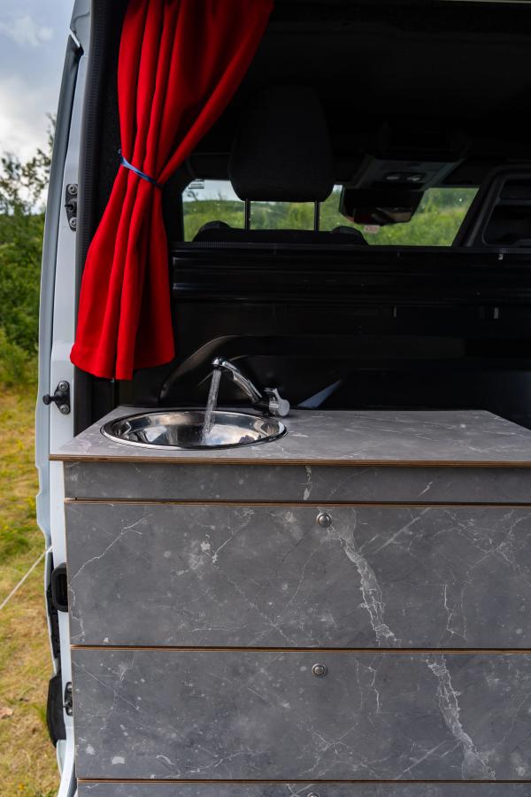Kitchen unit with running tap, steel sink and 2 drawers by the sliding side door