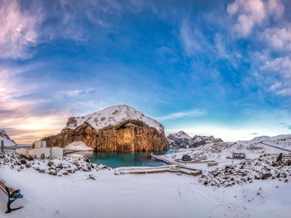 a winter landscape of an island covered by snow