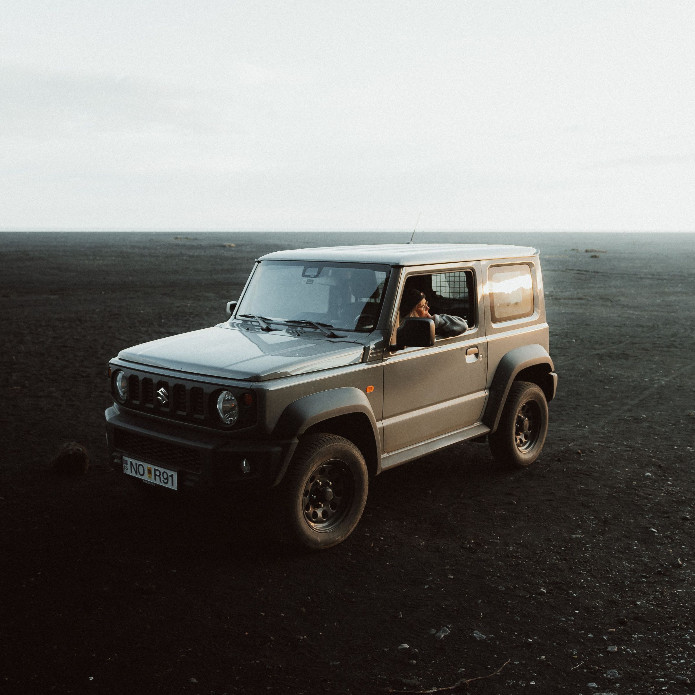 a 4x4 car on a volcanic field