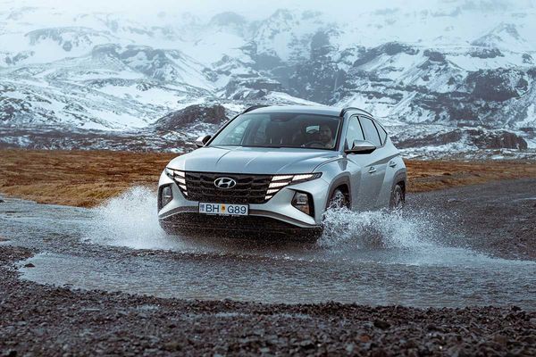 Rental car crossing a river in Iceland