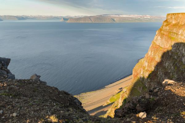 a view of a large body of water from a cliff