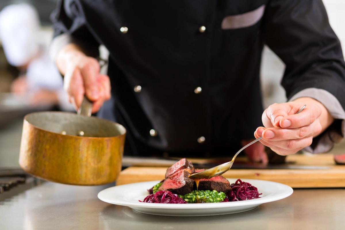 akureyri restaurants: a cook making a very reasonable price amazing food as a main course