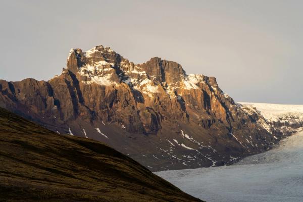 the peak of a mountain with dusk light