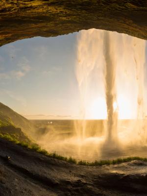 Seljalandsfoss seen from behind during the sunset