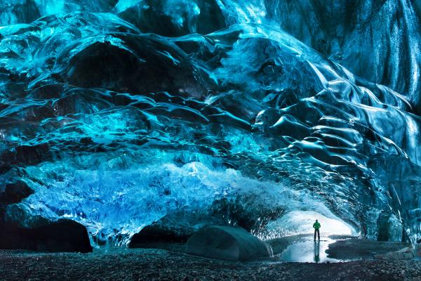 Man standing inside the Crystal Ice Cave