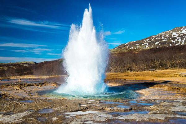 Witness the awe-inspiring power of nature at the Strokkur geyser eruption in Iceland's famed Golden Circle. Strokkur geyser mid-eruption, part of the Golden Circle route, Iceland.