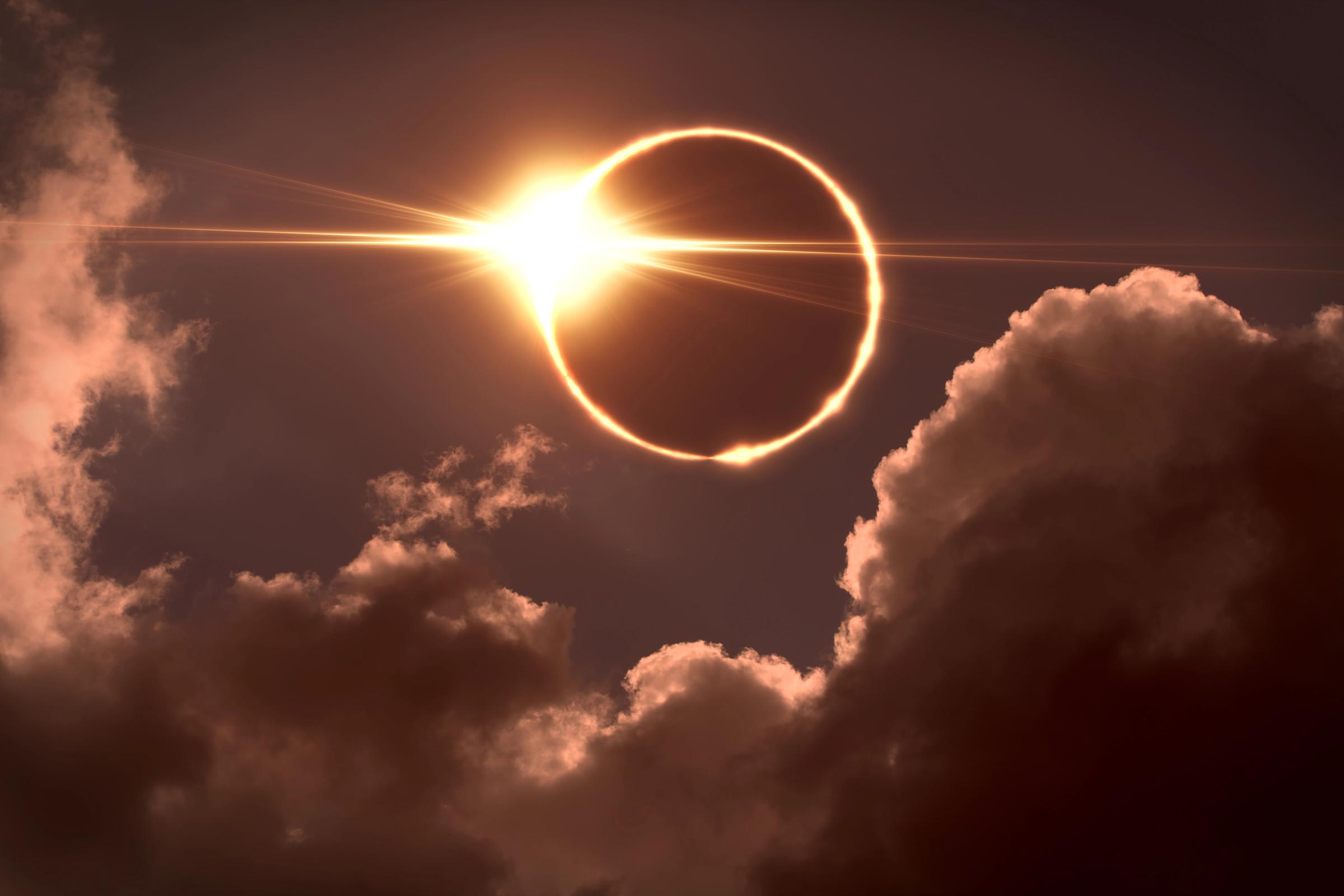 a partial eclipse of the sun is visible in the night sky .