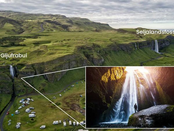 an aerial view of a waterfall and a man standing in front of it .
