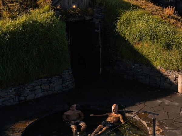 Two guys in a geothermal pool in the Sky Lagoon, Iceland