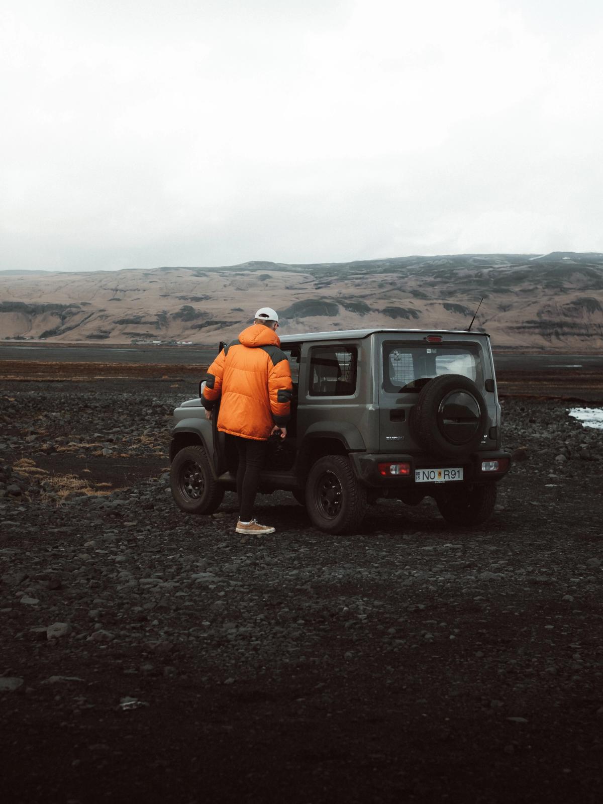 Exploring Iceland with a Rental Car Car overlooking stunning Icelandic landscape