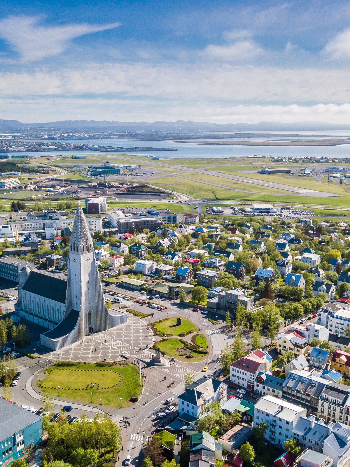 an aerial view of a city with a large church in the middle of it .