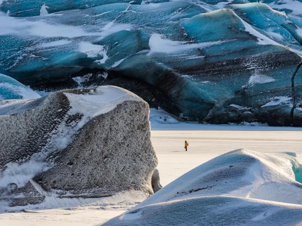 a person walking on a glacier
